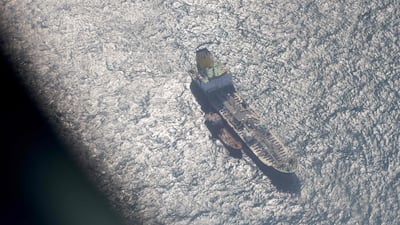 This picture taken on board a French Navy Falcon 200 Guardian surveillance aircraft shows a boat next to a ship in the Yellow Sea between the Korean Peninsula and China, during a mission to scan the ocean surface for signs of illegal activity. AFP