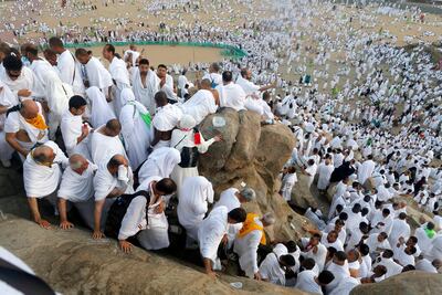Pilgrims make their way down Mount Arafat on Saturday morning. AP Photo