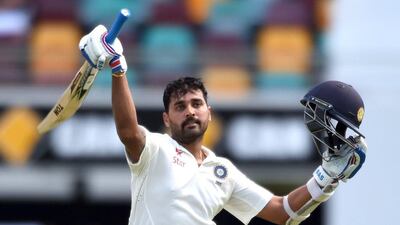 India batsman Murali Vijay reacts after scoring a century on Day 1 of the second Test match against Australia in Brisbane on Wednesday. Dave Hunt / EPA / December 17, 2014