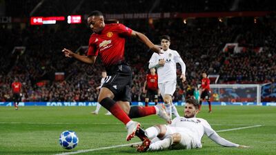 Manchester United's Anthony Martial skips over a challenge. Reuters