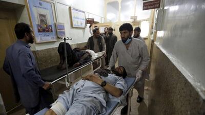Injured men are brought to a hospital for treatment after a suicide bombing in Asadabad, capital of Afghanistan’s Kunar province, on February 27, 2016. Parwiz / Reuters