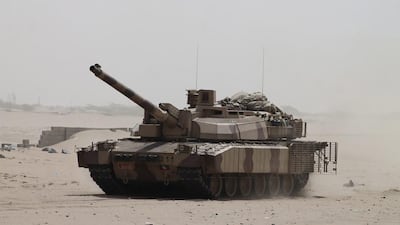 A tank belonging to pro-government Yemeni fighters drives near to the Al Anad airbase in the southern province of Lahj on August 3, 2014, the same day that loyalist forces seized the abse from Houthi rebels. Wael Qubady/AP Photo