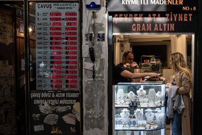 A woman shops at a gold store in Istanbul's famous Grand Bazaar.