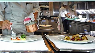 A friend of the writer who owns a cafe says that helping out in the kitchen has yielded many benefits. Amy Leang / The National