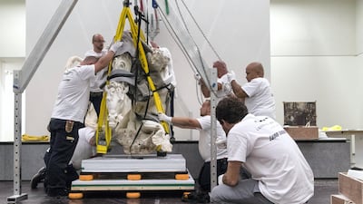 The installation was also overseen by Louvre Abu Dhabi's senior curatorial team. Christopher Pike / The National