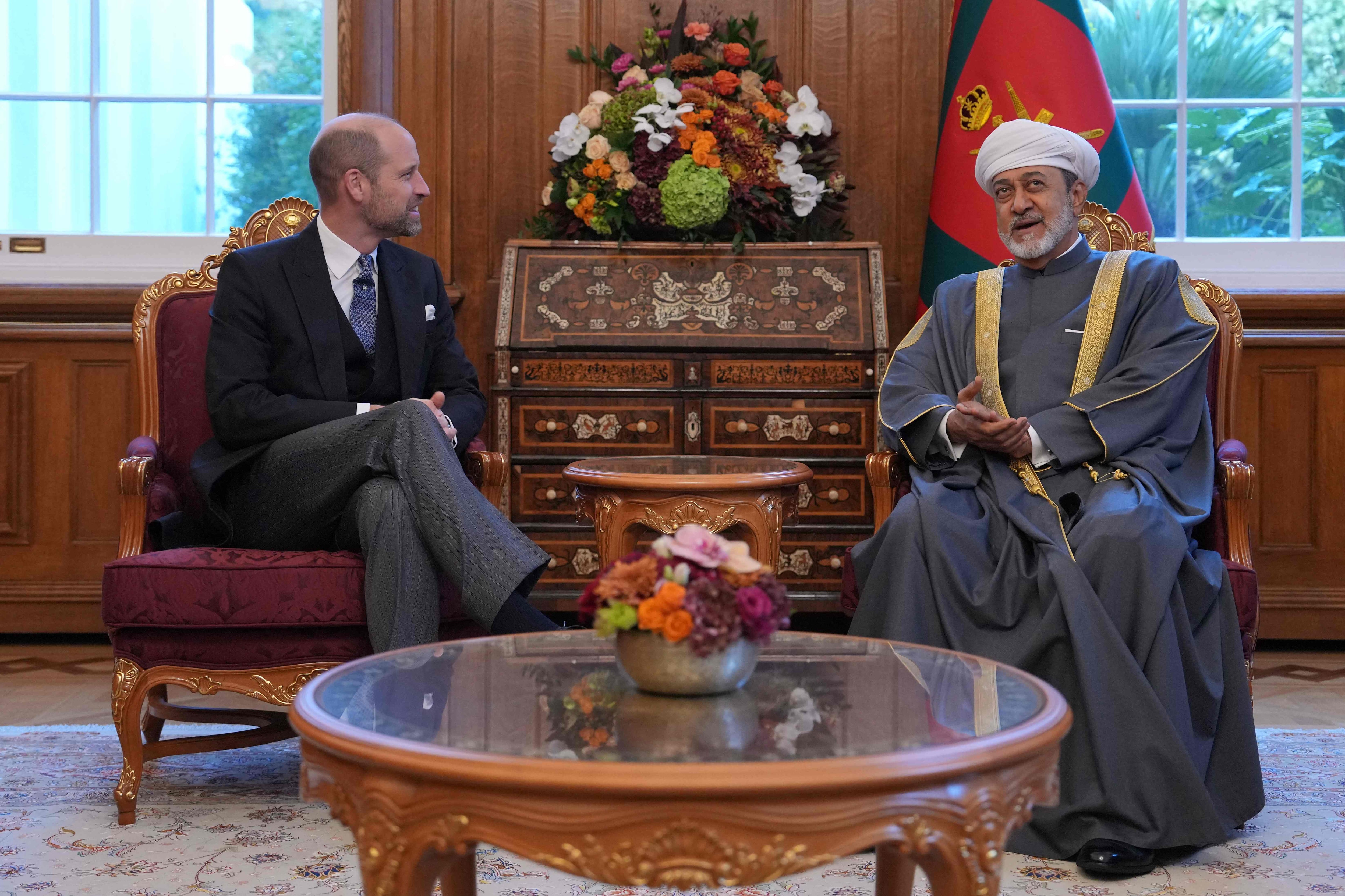 Prince William, Prince of Wales, speaks to Sultan Haitham at the Sultan's residence in London. AFP