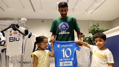 Fans with a Neymar Al Hilal shirt at the club shop in Riyadh. Reuters