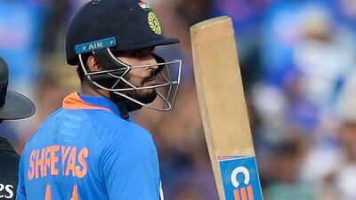 India's Shreyas Iyer raises his bat after reaching fifty on Sunday. AFP