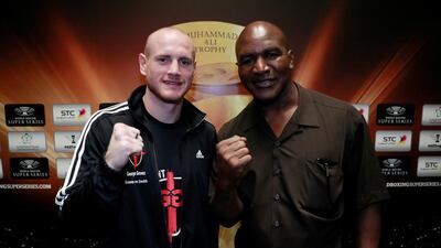 Evander Holyfield, right, poses with WBC super-middleweight champion George Groves ahead of the latter's WBSS Final fight against Callum Smith in Jeddah on Friday. Reuters