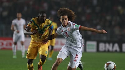 Tunisia's Hannibal Jegham shrugs off the challenge of Hamari Traore of Mali. EPA