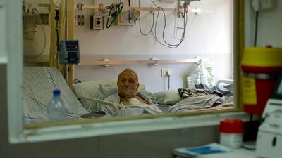 A patient receives treatment at the hospital. It was set up in 1968 and is considered one of the most important and leading medical institutions in Palestine, but it suffers from high debts. Photo: Getty Images