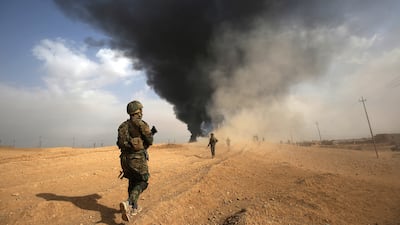 Iraqi forces advance towards the city of al-Qaim, in Iraq's western Anbar province near the Syrian border, as they fight against remnant pockets of ISIS forces, on November 3, 2017.