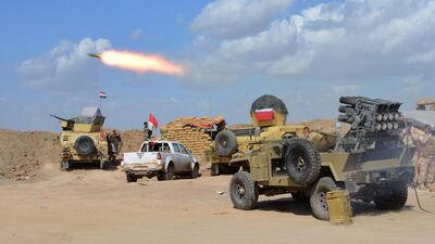 Iraqi forces fire weaponry from a position in the northern part of Diyala province, bordering Salahuddin province, as they take part in an assault to retake the city of Tikrit from ISIL fighters on March 2, 2015. Younis Al Bayati/AFP Photo