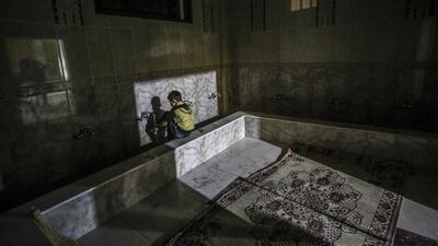 A young Syrian boy washes himself before praying in a mosque in Hamorya, Eastern Al-Ghouta province, Syria, 02 July 2016. In Islamic belief Laylat Al Qadr, one of the holiest nights in the holy Muslim month of Ramadan, marks the night when the first verses of the Quran were revealed to the Prophet Muhammad. EPA