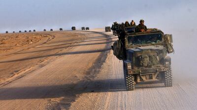 A convoy of US marines crosses the desert near Diwaniya in central Iraq on April 4, 2003. AFP