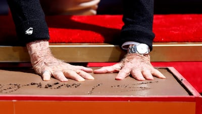 Marvel Comics co-creator Stan Lee places his handprints in cement during a ceremony in the forecourt of the TCL Chinese theatre. Mario Anzuoni / Reuters
