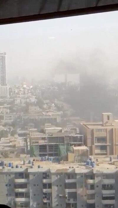 Smoke rises from the Chinese consulate in Karachi in a still from a posted on social media. Saqib Zia via Reuters