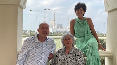 Neville Martin with his sisters, from left to right, Louise Martin and Alison Birtwhistle. Photo: Cleveland Clinic Abu Dhabi