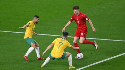 Australia's Aziz Behich and Mathew Leckie block Andreas Skov Olsen's run. AFP