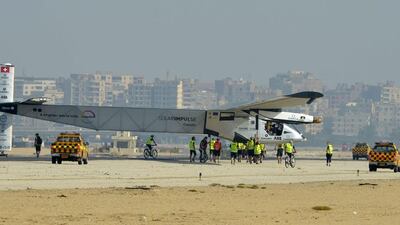 Solar Impulse 2 ground crew surround the aircraft after it landed at Cairo International Airport. Khaled Desouki / AFP
