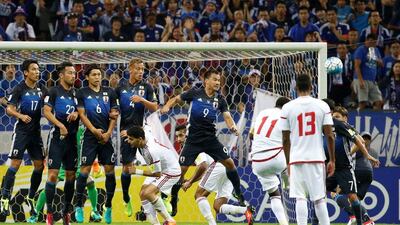 UAE striker Ahmed Khalil (11) scores the equalising goal from a free-kick. Kim Kyung-Hoon / Reuters