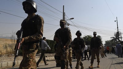 Pakistani soldiers patrol outside the Chinese consulate in Karachi after an attack. AFP