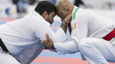 Paulo Jose Pinto, left, from Brazil, fights Bruno Emanoel Oliveira, during a Male Black Master 94 KG match at Al Ain Jiu Jitsu Open Championship. Reem Mohammed / The National