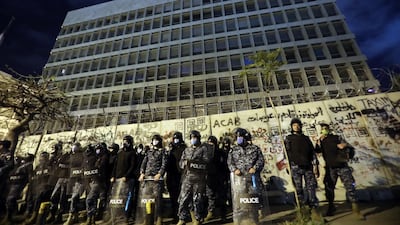Riot police line up outside the headquarters of the Lebanese central bank during an anti-government demonstration in Beirut. Bloomberg