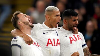 Tottenham Hotspur's James Maddison, Richarlison and Christian Romero celebrate after Joel Ward's own-goal. PA