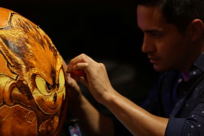 Artist Zach Faraday carves a pumpkin with Sonic the Hedgehog, demonstrating the character's prevailing popularity. Reuters