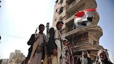 Yemeni tribesmen stand guard at a street leading to the residence of their tribal leader in Sanaa yesterday. According to media sources, Yemeni tribesmen have kidnapped a Norwegian man, who was working for the UN, from a main street in Sanaa.