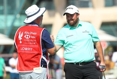 Shane Lowry and caddie Brian Martin after completing the first round at the 2019 Abu Dhabi HSBC Championship presented by EGA. Getty Images