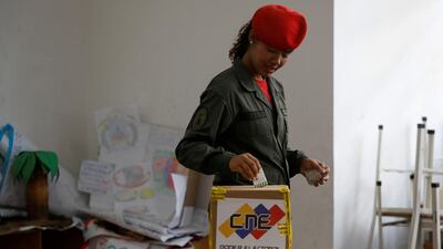 A Venezuelan soldier casts her vote at a polling station during the municipal legislators election in Caracas, Venezuela December 9, 2018. Reuters