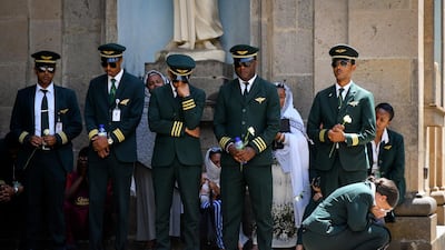 Pilots and crew members of Ethiopian Airlines react as they attend a burial service for victims of the Ethiopian Airlines plane crash. Boeing's 737 Max 8 aircraft has come under scrutiny after similarities were drawn between crashes in Ethiopia and Indonesia within a few months. EPA