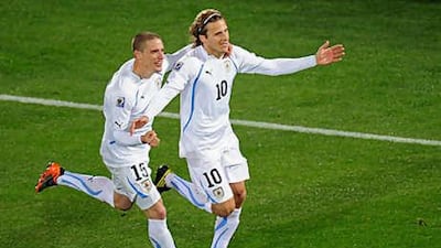 Uruguay's Diego Forlan celebrates after scoring his second against South Africa last night.