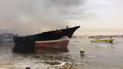 Emergency crews are also fire-fighting on boats, trying to take the flames under control and moving the affected vessels from shore to stop it from spreading further. Antonie Robertson / The National