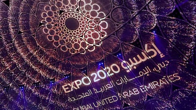 A logo of the Dubai Expo 2020 is projected during the opening ceremony, on September 30, 2021. AFP