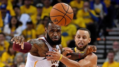 Golden State Warriors guard Stephen Curry, right, and Cleveland Cavaliers forward LeBron James go for a loose ball during the second quarter in Game 1 of the 2018 NBA Finals at Oracle Arena. Kyle Terada USA Today