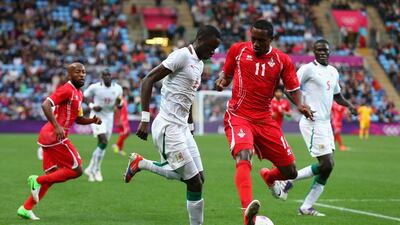 Cheikhou Kouyate of Senegal and Ahmed Khalil of UAE contest the ball. Getty Images