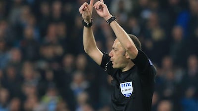 Turkish referee Cuneyt Cakir calls for a VAR decision on Tottenham Hotspur striker Fernando Lorente's goal. The goal was allowed to stand. AFP