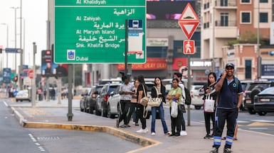 People in Abu Dhabi on March 3. Business activity has been continuing in the UAE despite the recent Iran attacks. Victor Besa / The National