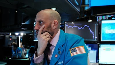 Traders work on the floor of the New York Stock Exchange (NYSE) in New York City. AFP