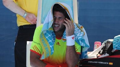 Fernando Verdasco, the Spanish player, feels the heat at Melbourne Park on Monday.