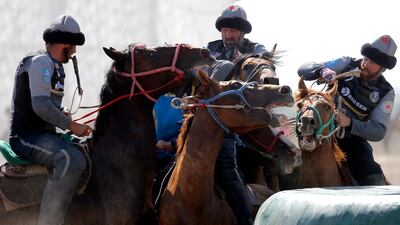 Kazakh and US horsemen take part in kok-boru. EPA