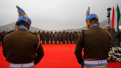 Indian paramilitary soldiers pay tribute at memorial during a ceremony to mark the first anniversary since the deadly Pulwama attack. EPA