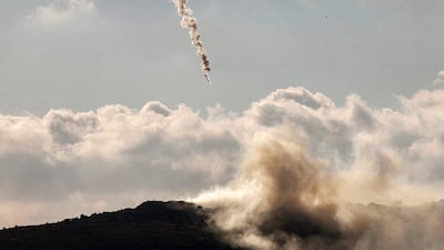 A flare fired by the Israeli military lands over the highlands of the area of Ali al-Taher as seen from nearby Marjayoun (Marjeyoun) in southern Lebanon on June 14, 2026. Israel struck Beirut's southern suburbs on June 14, killing three people, in response to what it said was Hezbollah fire at northern Israel, while its military also carried out broader strikes on southern Lebanon. The latest escalation came amid expectations that a deal between the US and Iran to end the Middle East war could be imminent, but Iranian chief negotiator Mohammad Bagher Ghalibaf said there was "no point" in continuing peace talks with Washington after the strike. (Photo by AFP)