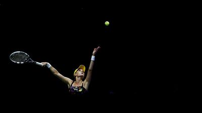 Agnieszka Radwanska prepares a serve against Petra Kvitova during her WTA Finals group play victory on Tuesday. Julian Finney / Getty Images / October 21, 2014