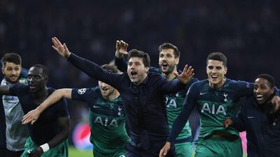 Manager Mauricio Pochettino, centre, celebrates after Tottenham's incredible victory. EPA