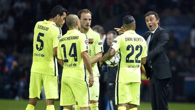 Barcelona coach Luis Enrique talks to his players during their Champions League loss to Paris Saint-Germain on Tuesday night at the Parc des Princes. Benoit Tessier / Reuters / September 30, 2014