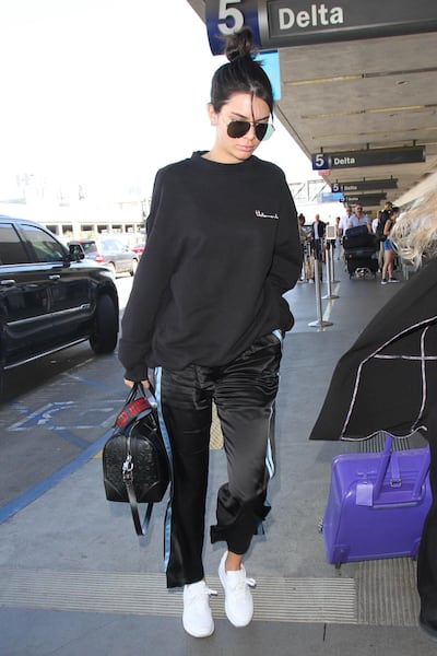 Kendall Jenner is a fan of the tracksuit airport look. Photo: Getty